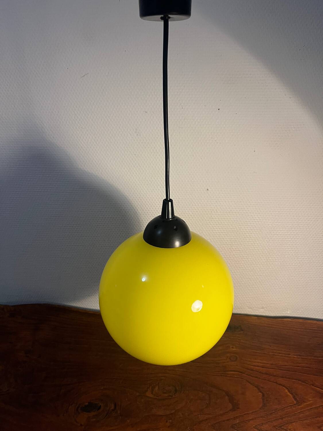 Yellow opaline globe pendant light from the 70s