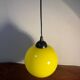 Yellow opaline globe pendant light from the 70s