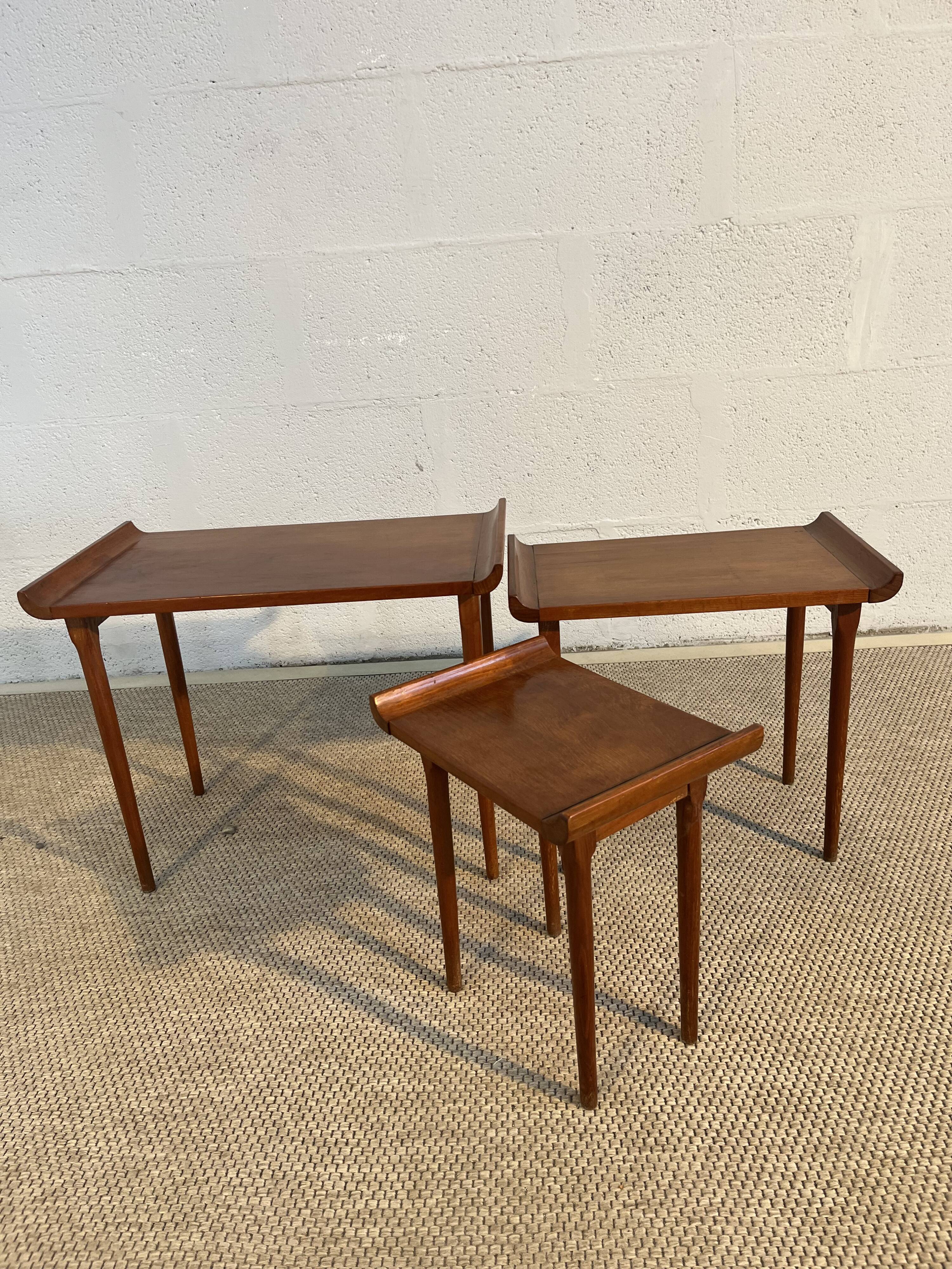 Set of three nesting low tables in a Japanese style, made of mahogany.