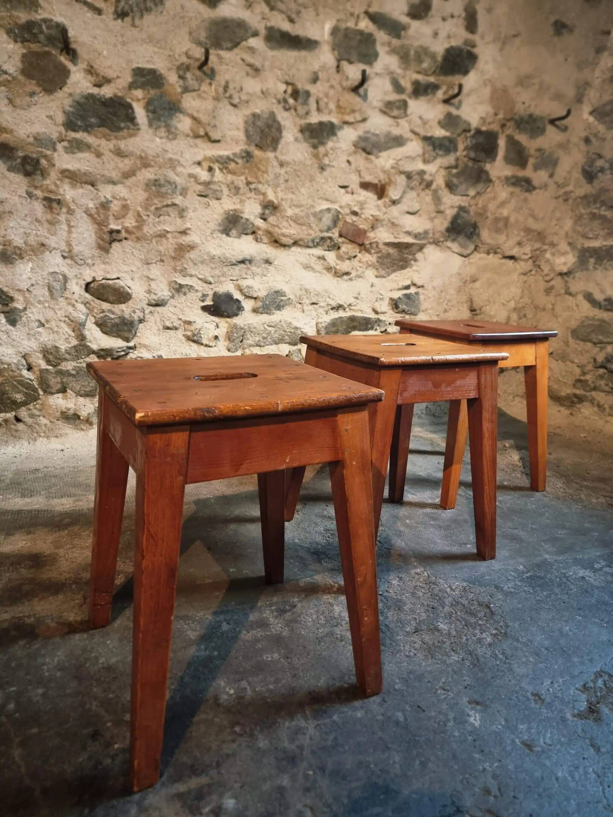 Set of 3 vintage French wooden stools from the 1950s.