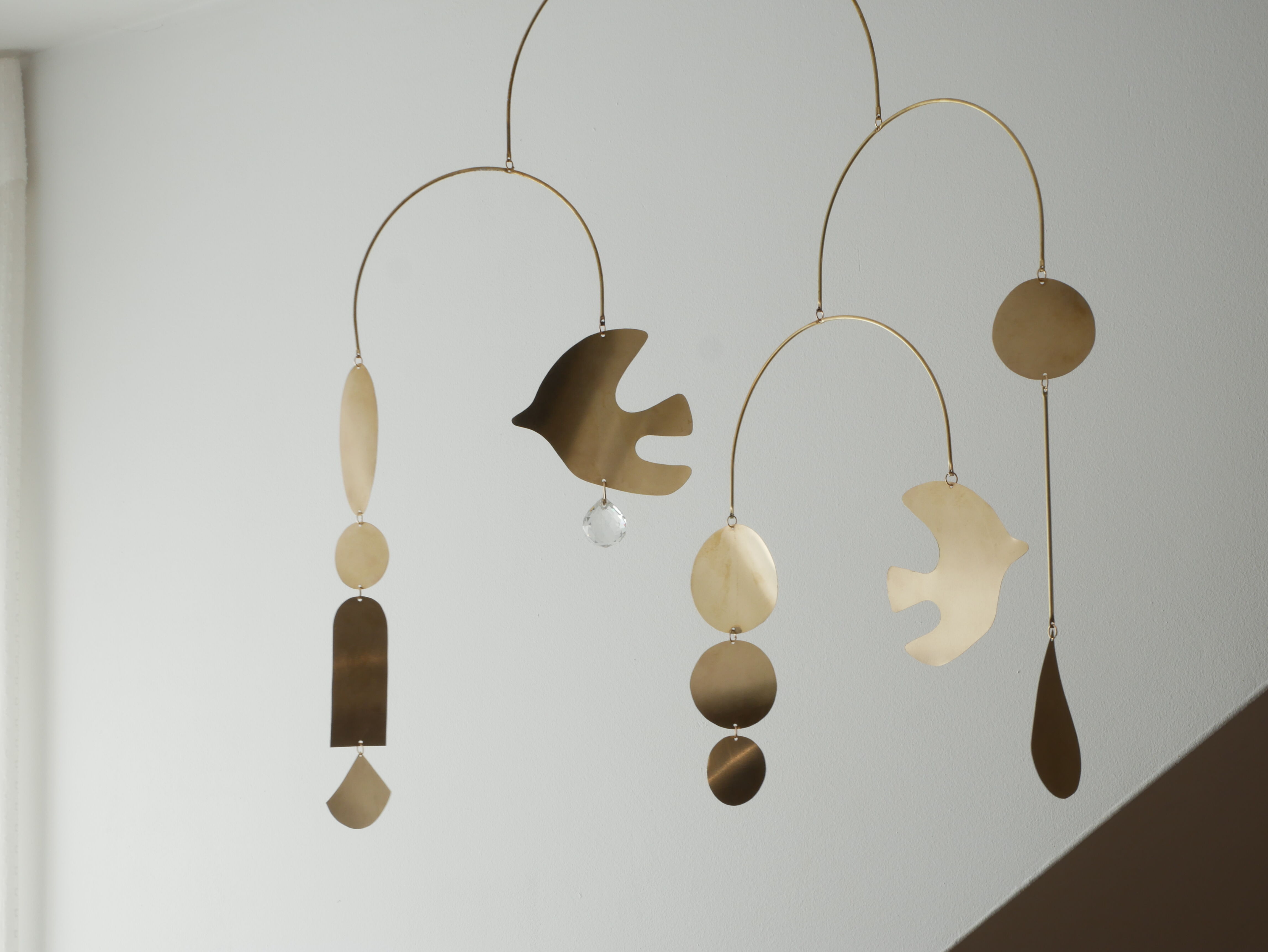 Mobile model Rana . Mobile in abstract brass.