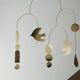 Mobile model Rana . Mobile in abstract brass.
