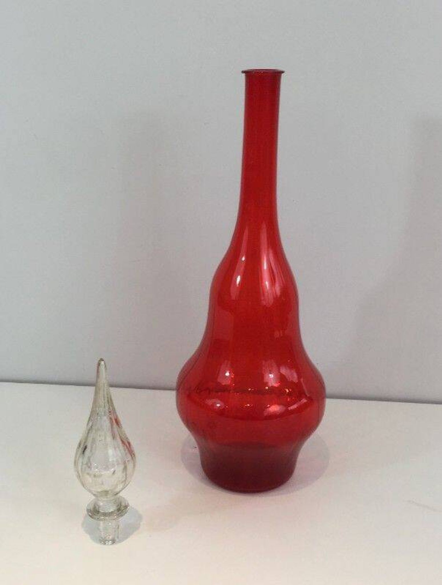 Large designer bottle in red glass