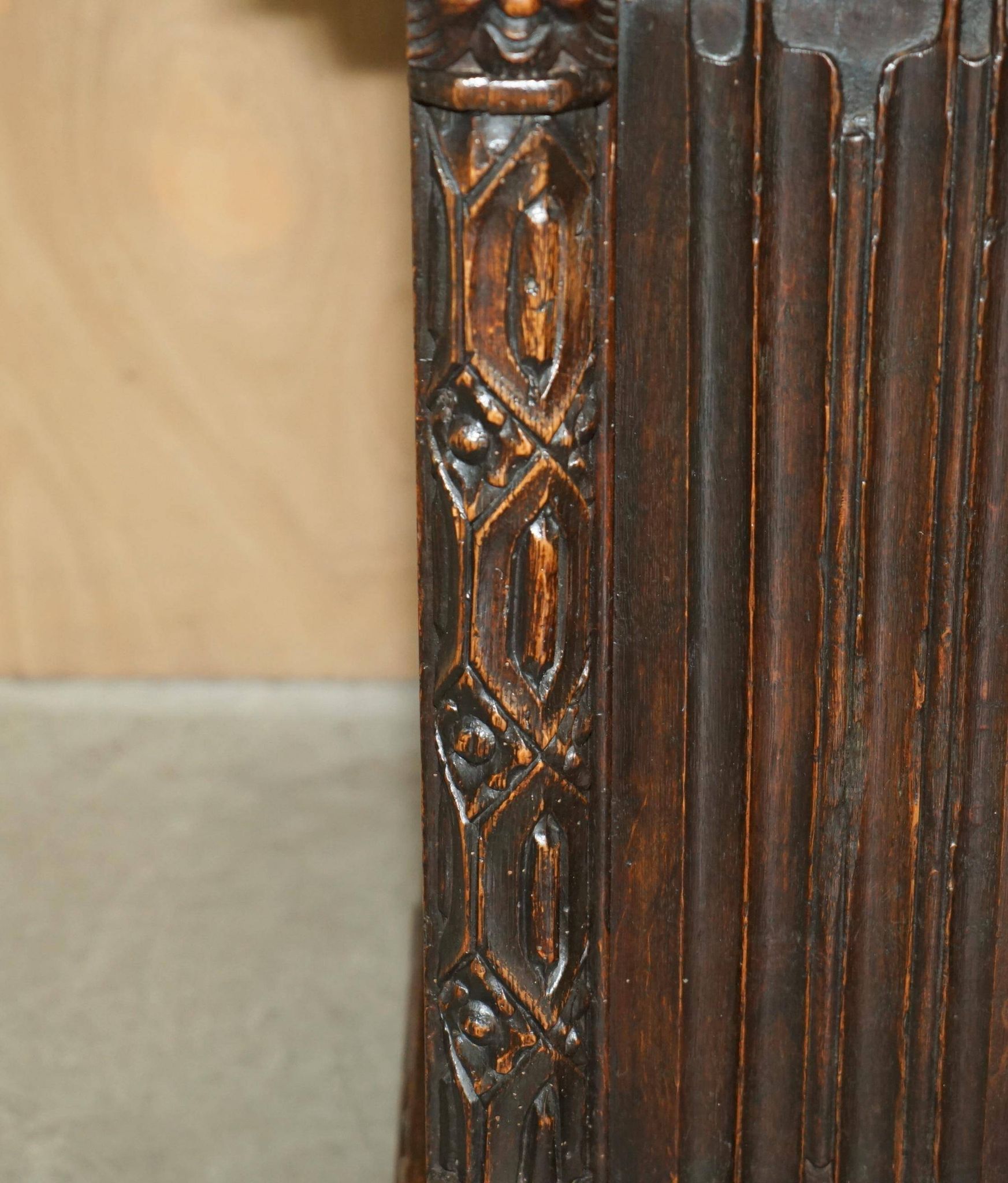 Jacobean hardwood library with carved panels and glass doors.