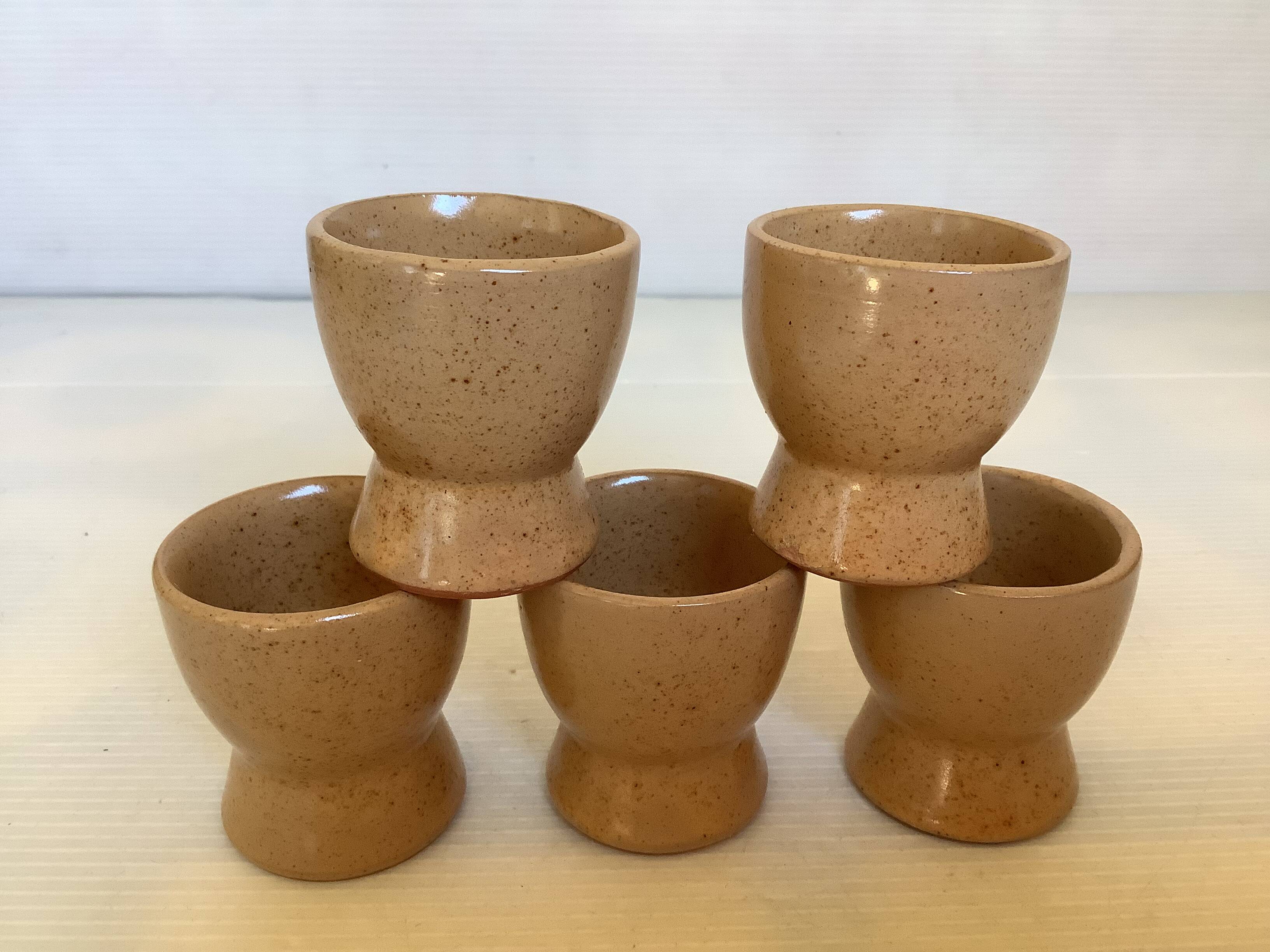 Five handmade stoneware egg cups