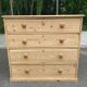 Victorian commode from the 19th century stripped to raw solid wood with ceramic knobs.