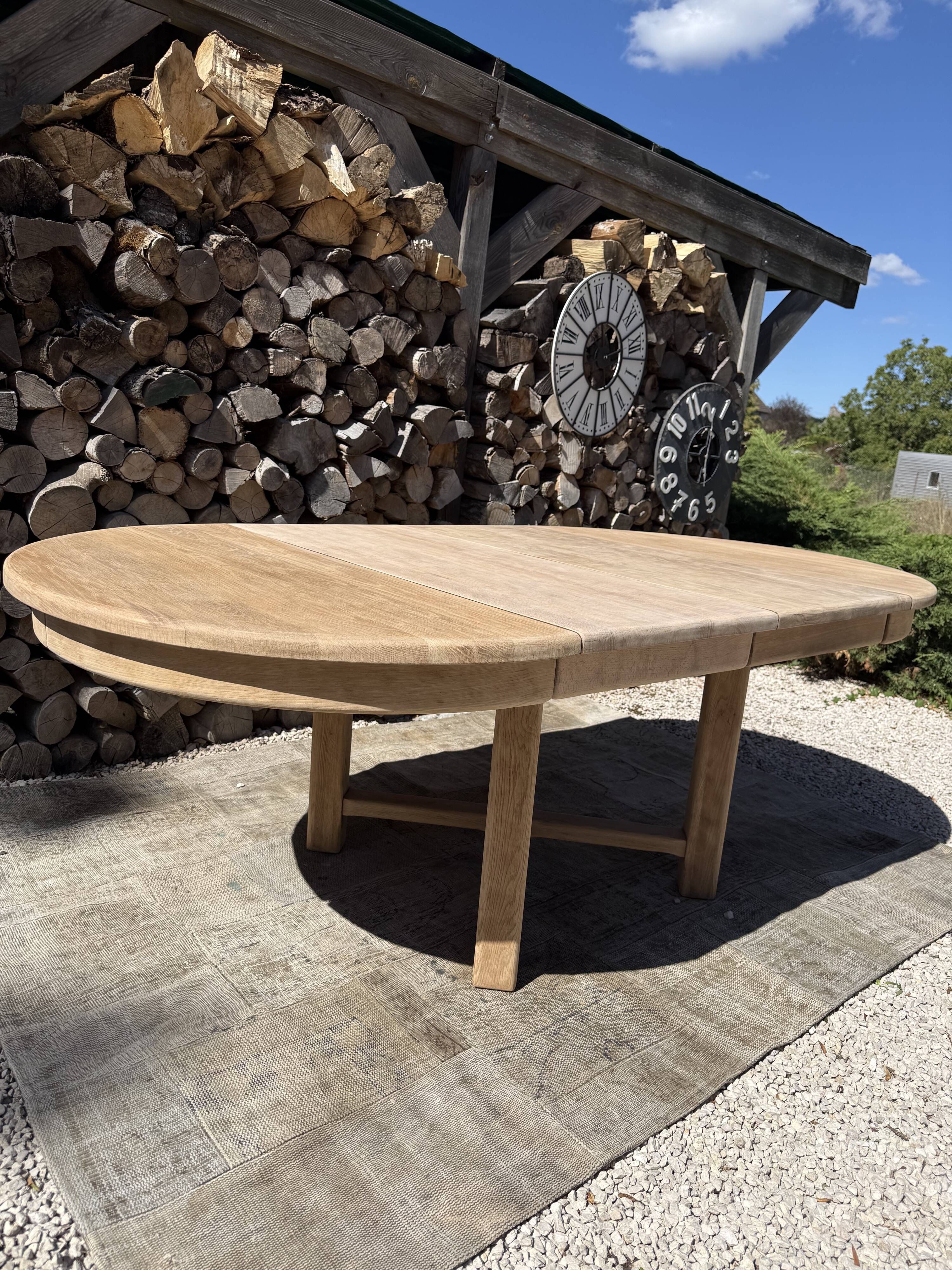 Round solid oak table with extensions, maximum 220cm.
