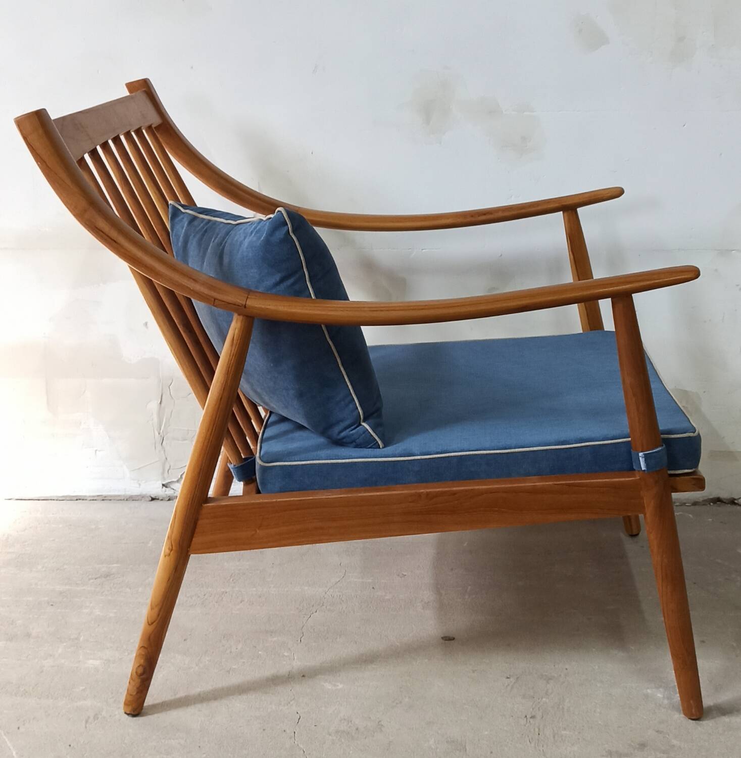Pair of cozy teak armchairs with cushions