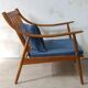 Pair of cozy teak armchairs with cushions