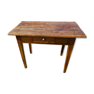 Wooden table with a drawer