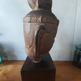 Head of Buddha on wooden base. Resin sculpture from Japan