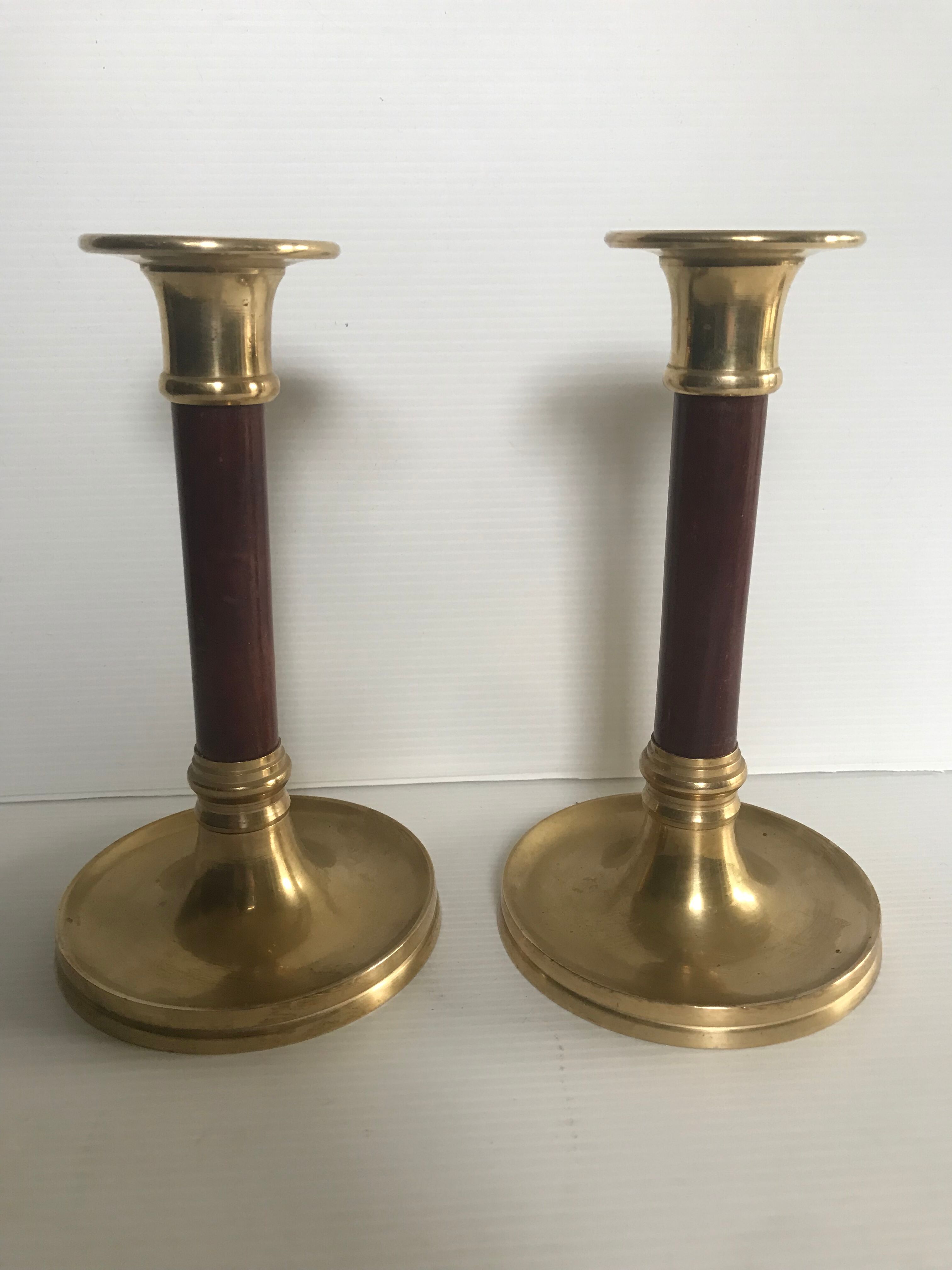 Pair of Scandinavian brass and teak candle holders