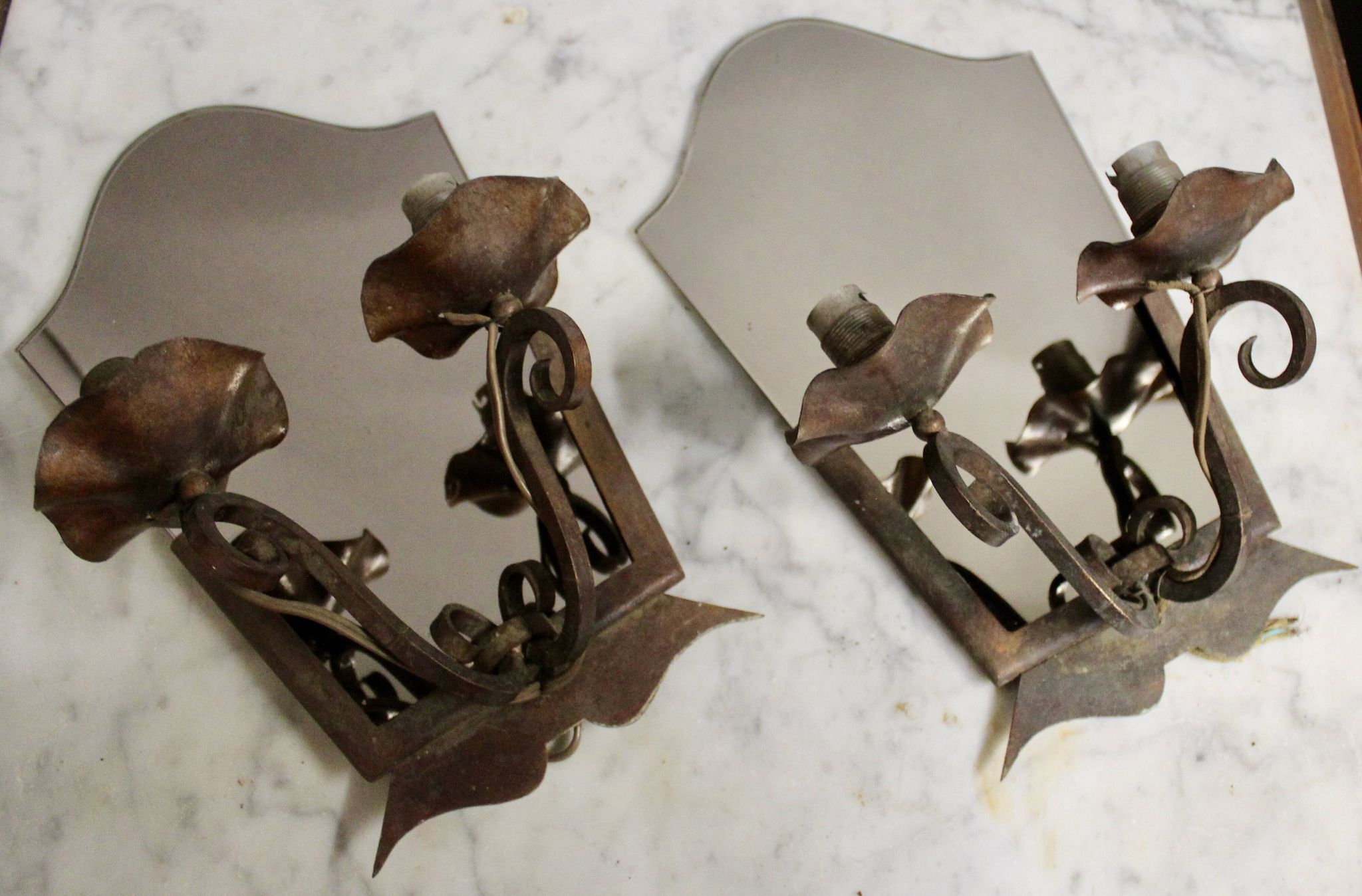 Pair of Art Deco wrought iron and smoked glass wall lights