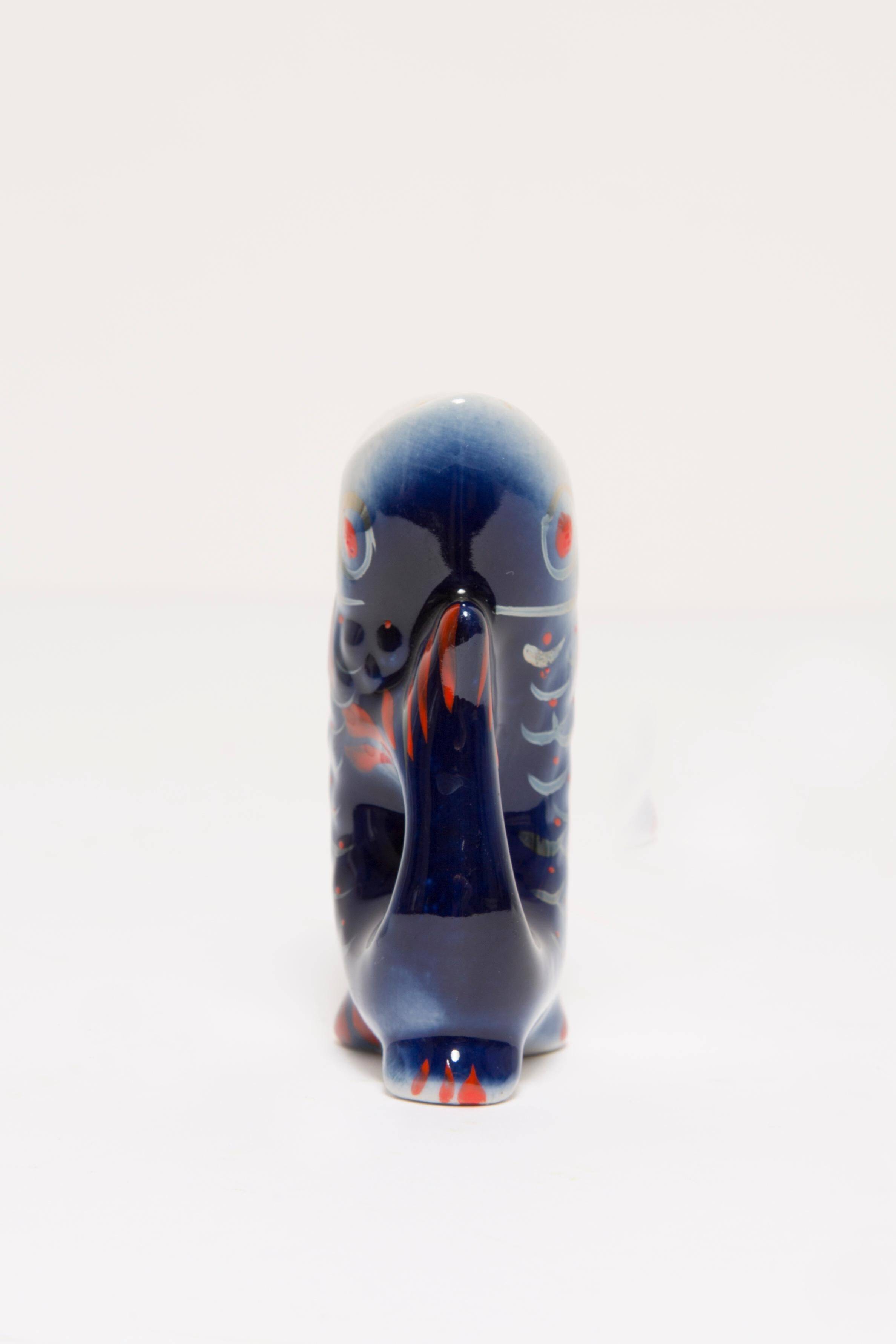 Set of 7 blue glass fish, mid-20th century.