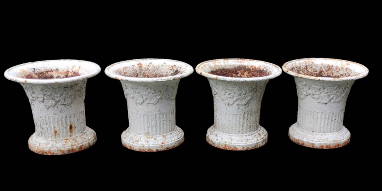 Series of 4 old cast iron vases