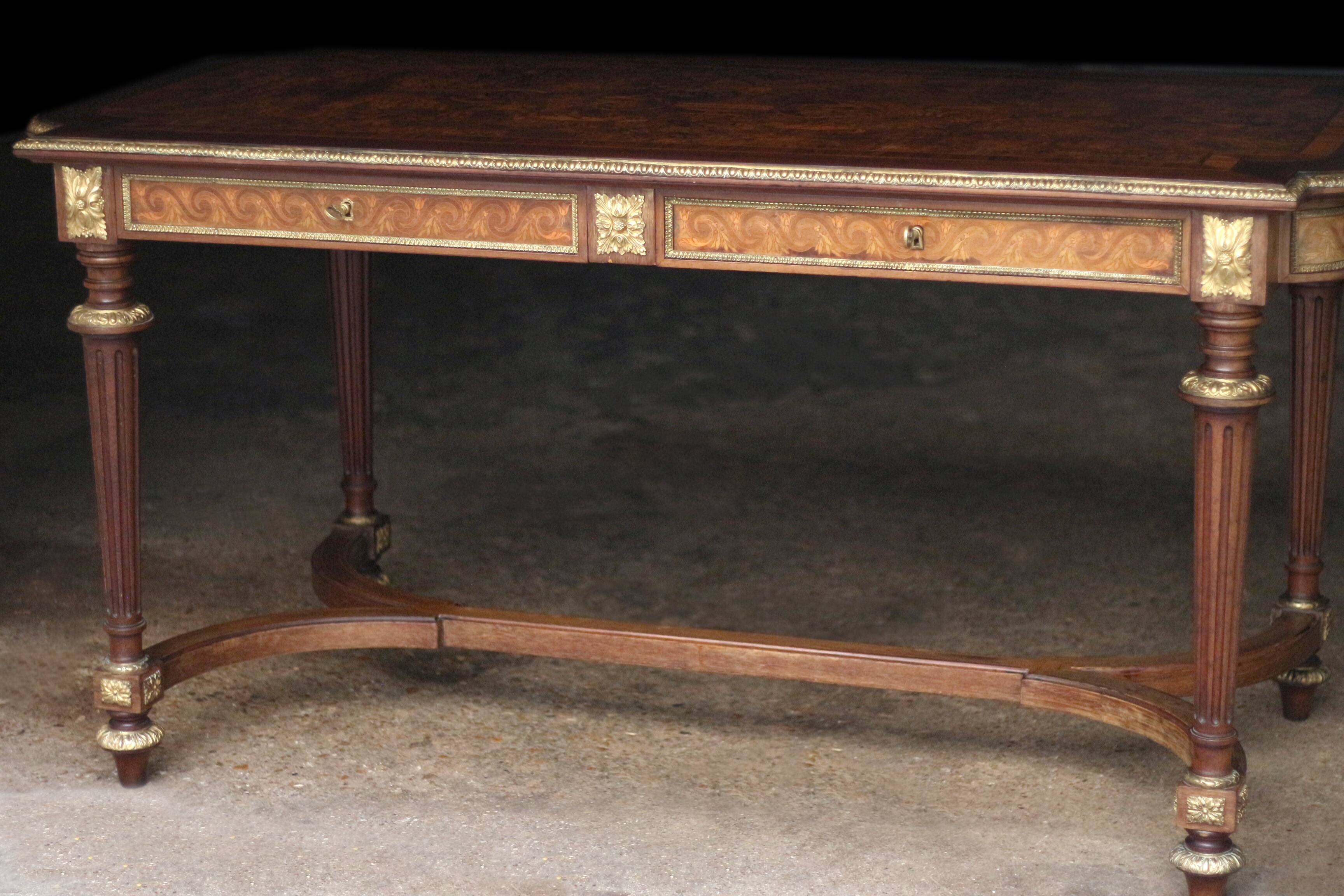 Superb Napoleon III table. Marquetry top and gilded bronzes.