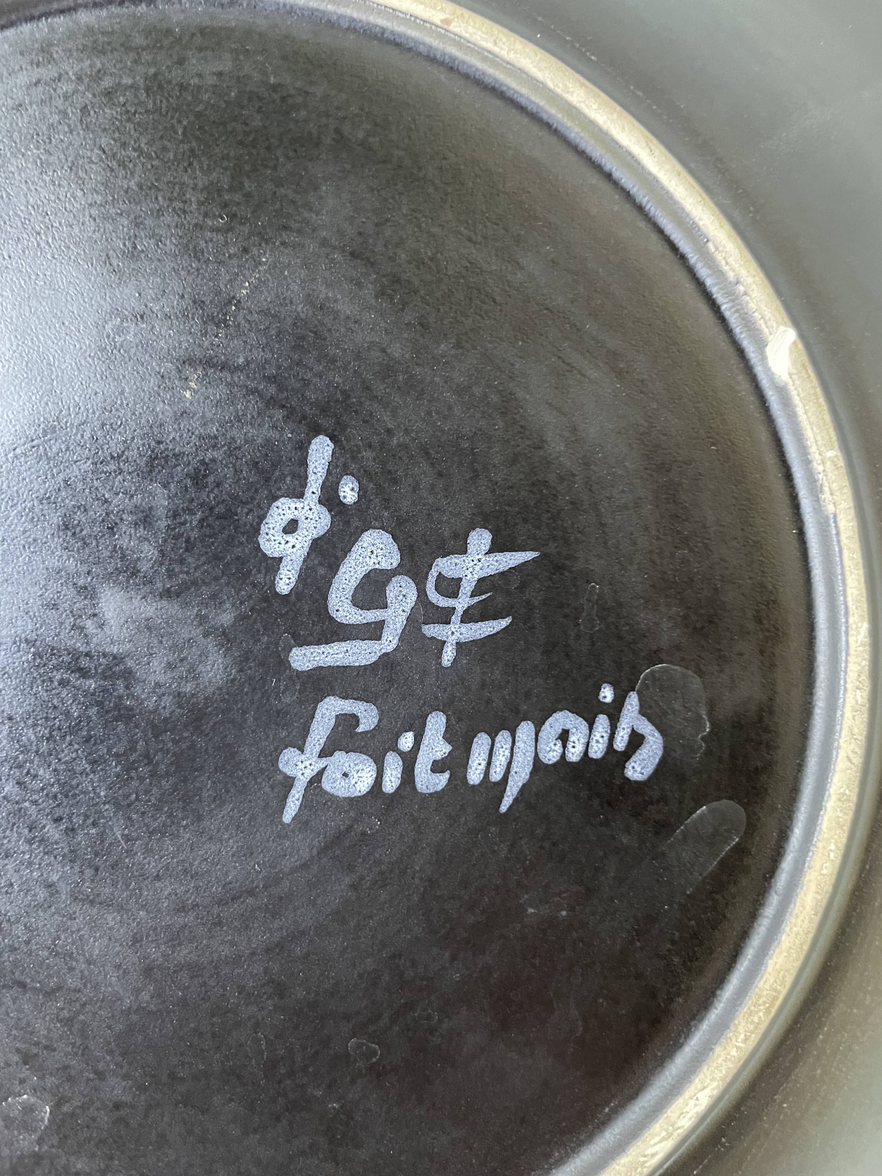 Assiette noire céramique années 60