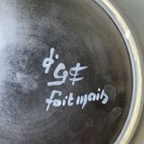 Black ceramic plate from the 60s