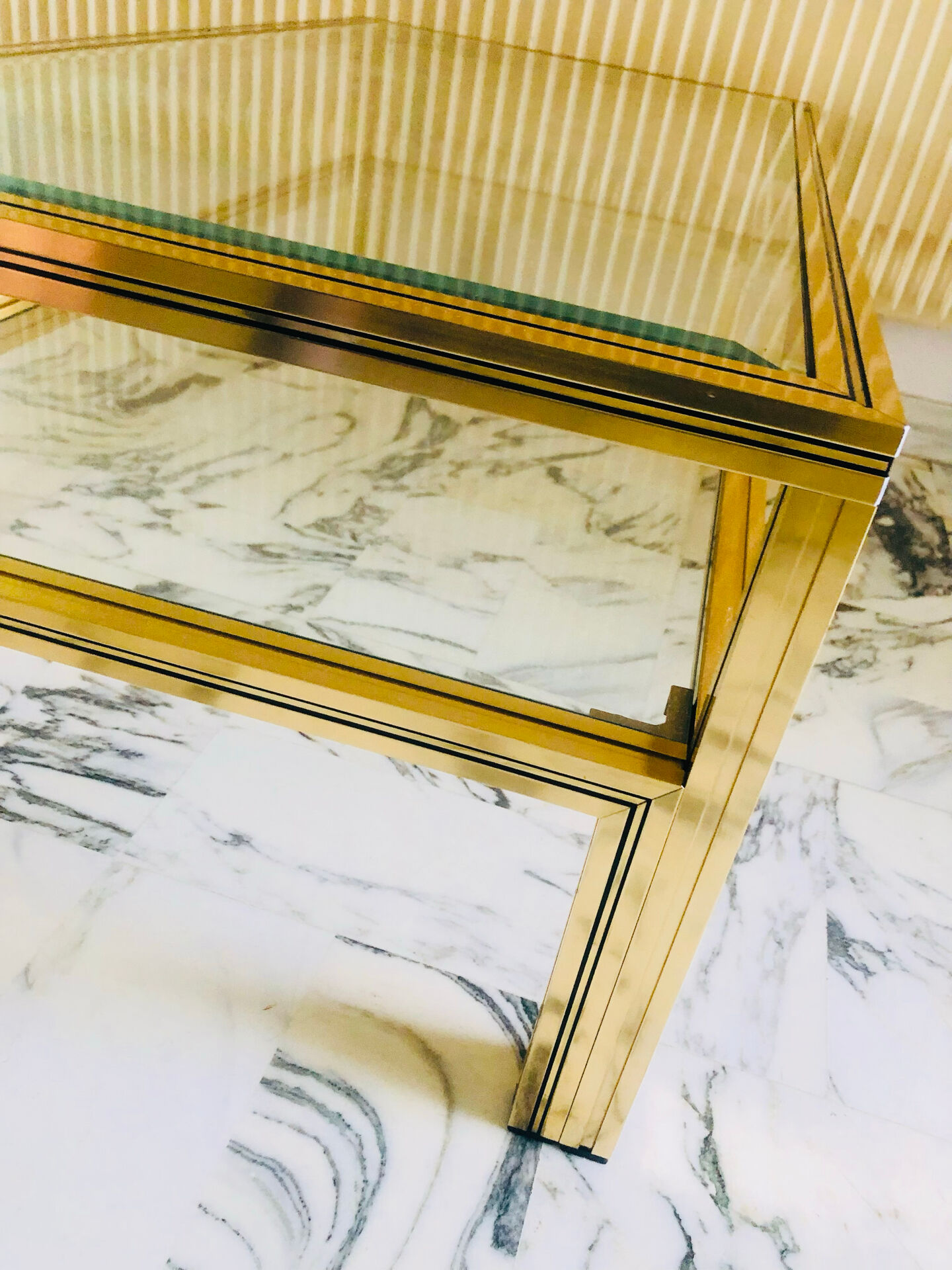 Coffee table with 2 brass and glass tops signed Pierre Vandel Paris, circa 70s.