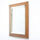 Art deco beveled mirror in an oak frame, 1940s.