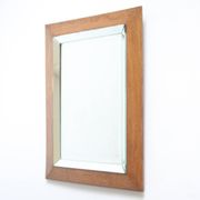 Art deco beveled mirror in an oak frame, 1940s.