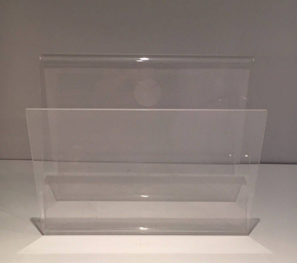 Acrylic magazine rack. Circa 1970.