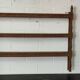 Old oak shelf back of glass counter wall