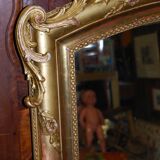 Miroir doré à fronton coquille de style Louis XV fin XIXème