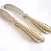 Two antique service knives in silver-plated metal, pearl frieze gowe alpacca.