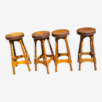 4 old leather and wood stools