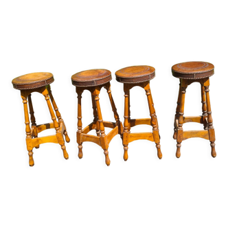4 old leather and wood stools