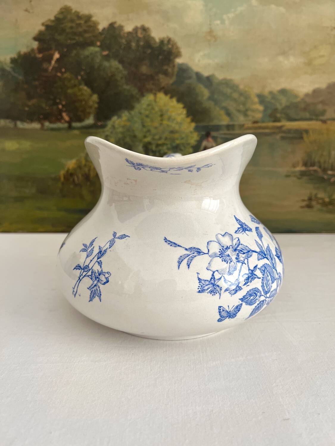 Antique chubby ironstone jug with floral and bird decoration