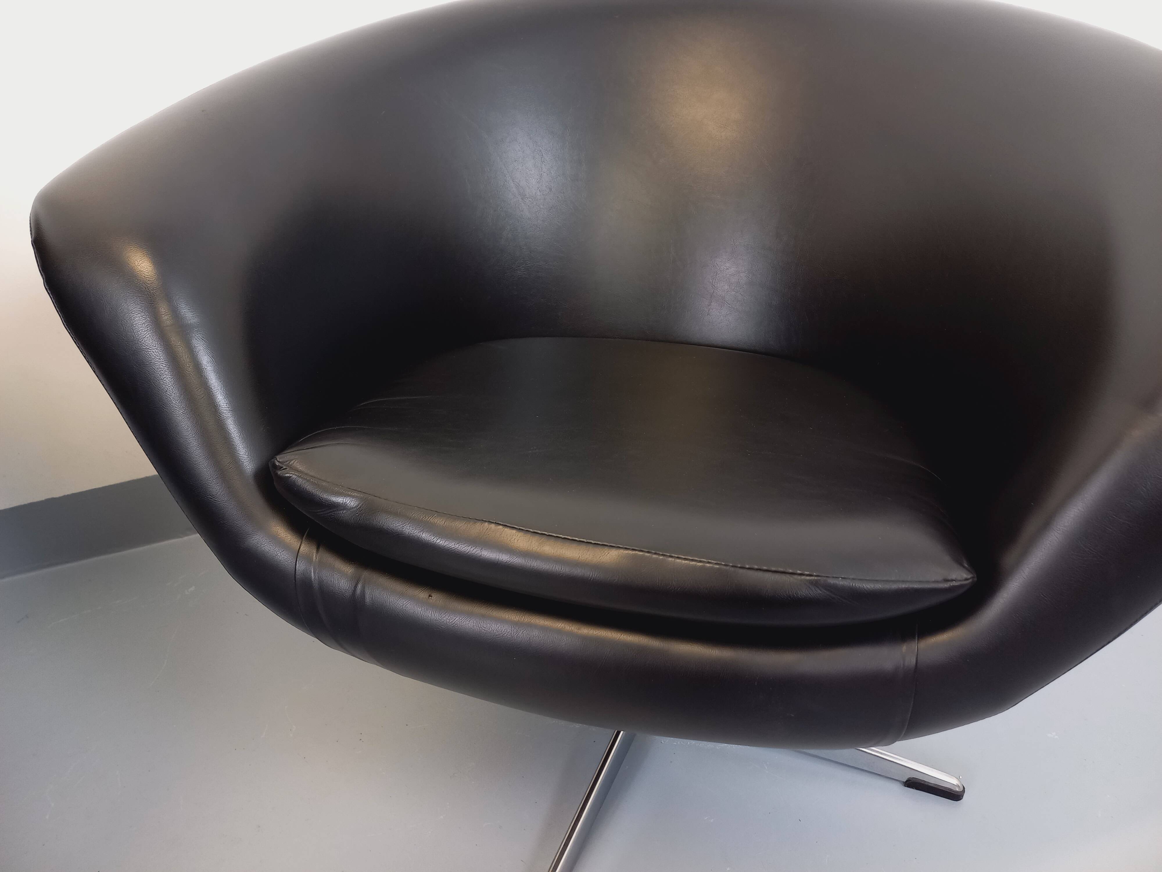 Pair of vintage Scandinavian swivel armchairs in faux leather and chrome.