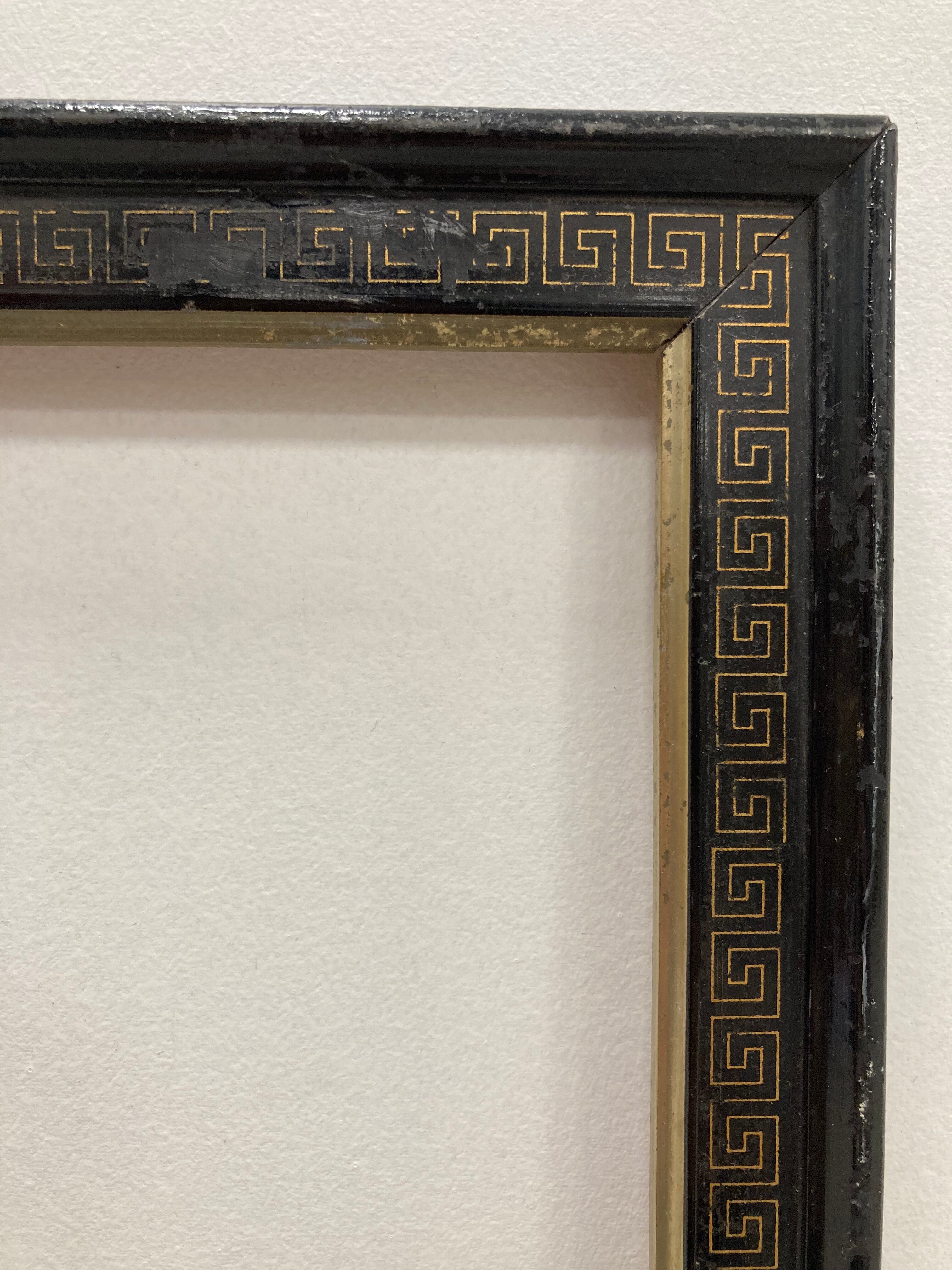 Black and gold frame decorated with Greek frieze decoration