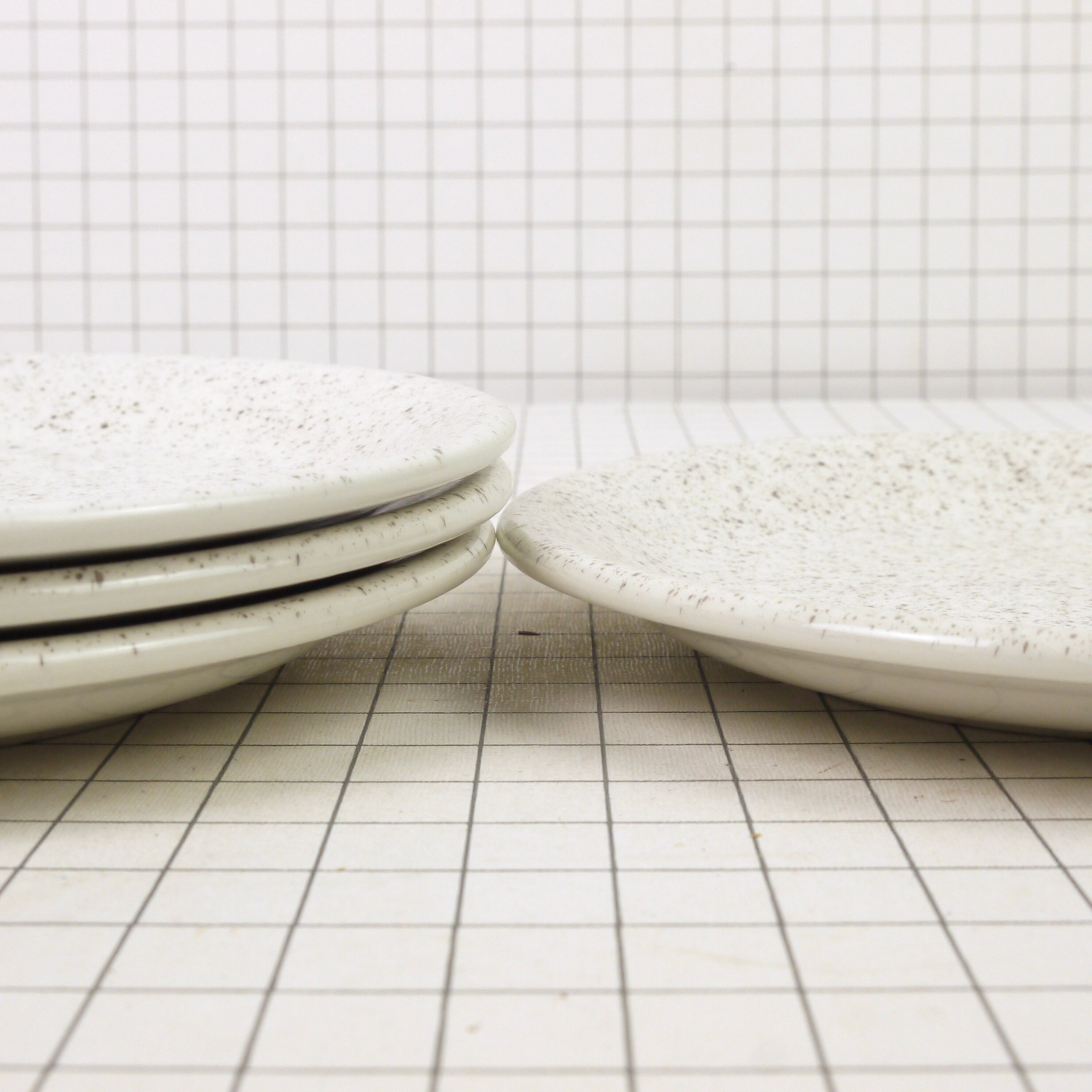 Four Ceraminter dessert plates