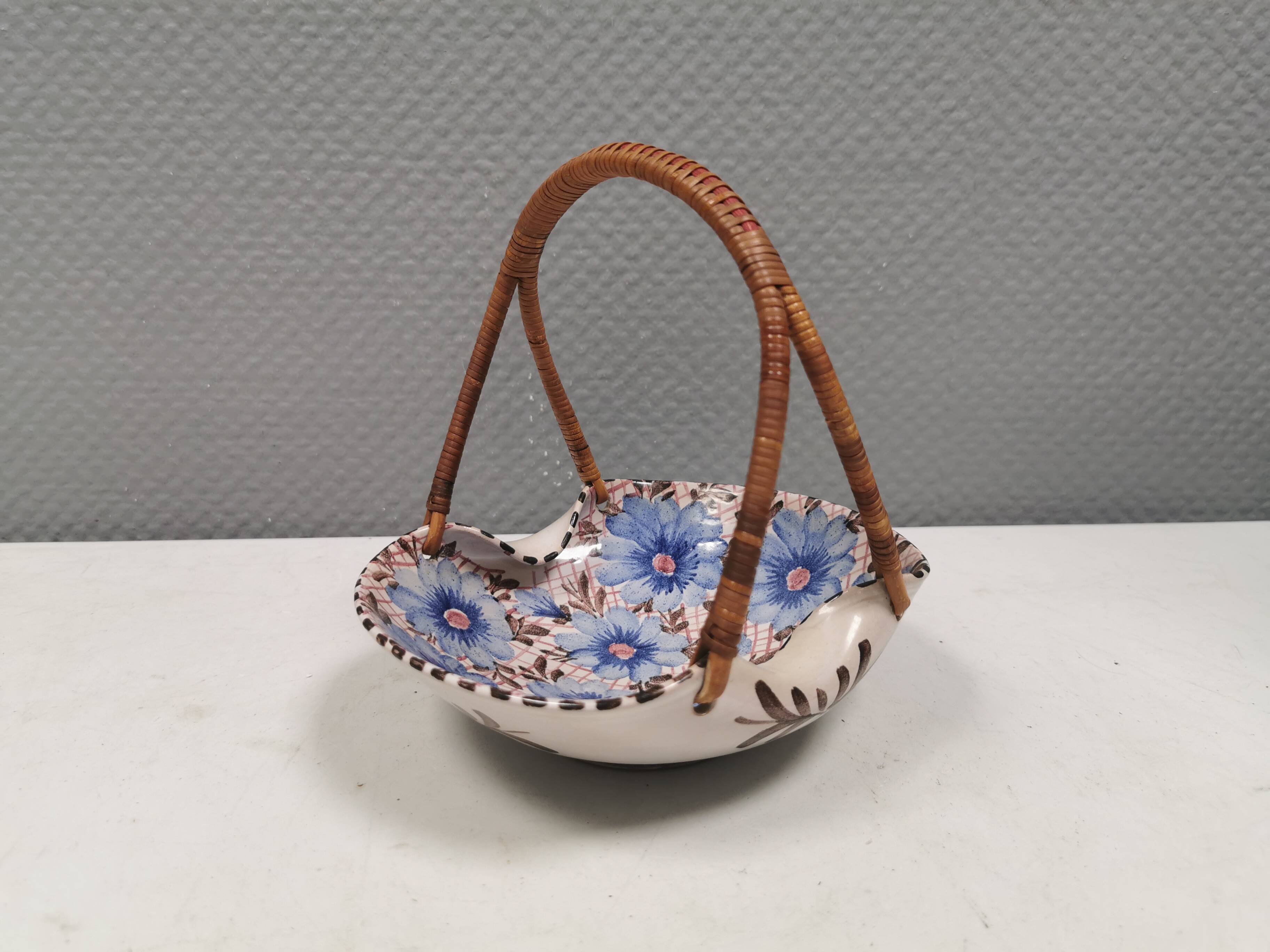 Beautiful small painted ceramic basket with woven handle