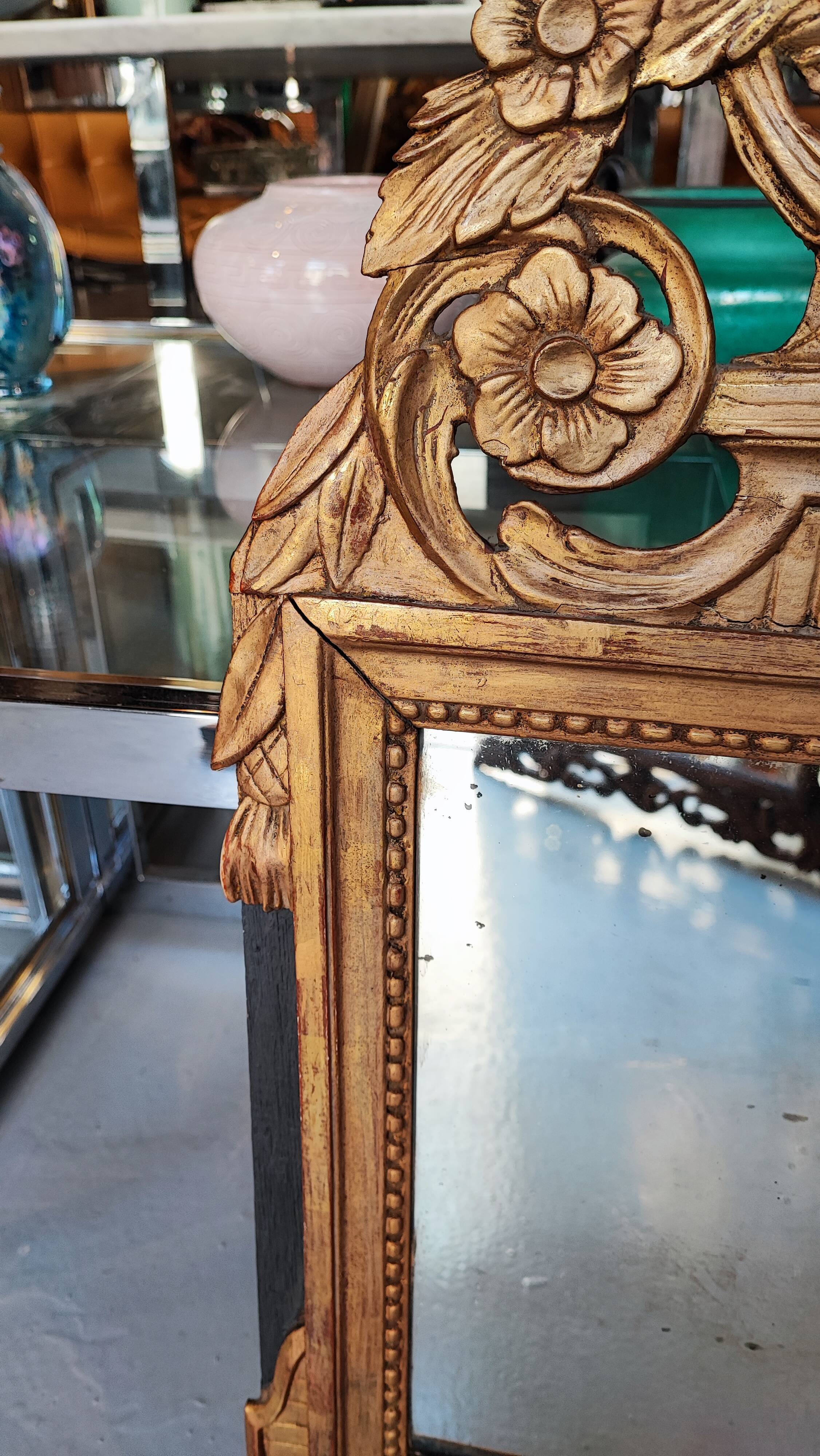 Louis XIV mirror in carved gilded wood, 18th century - 75 cm