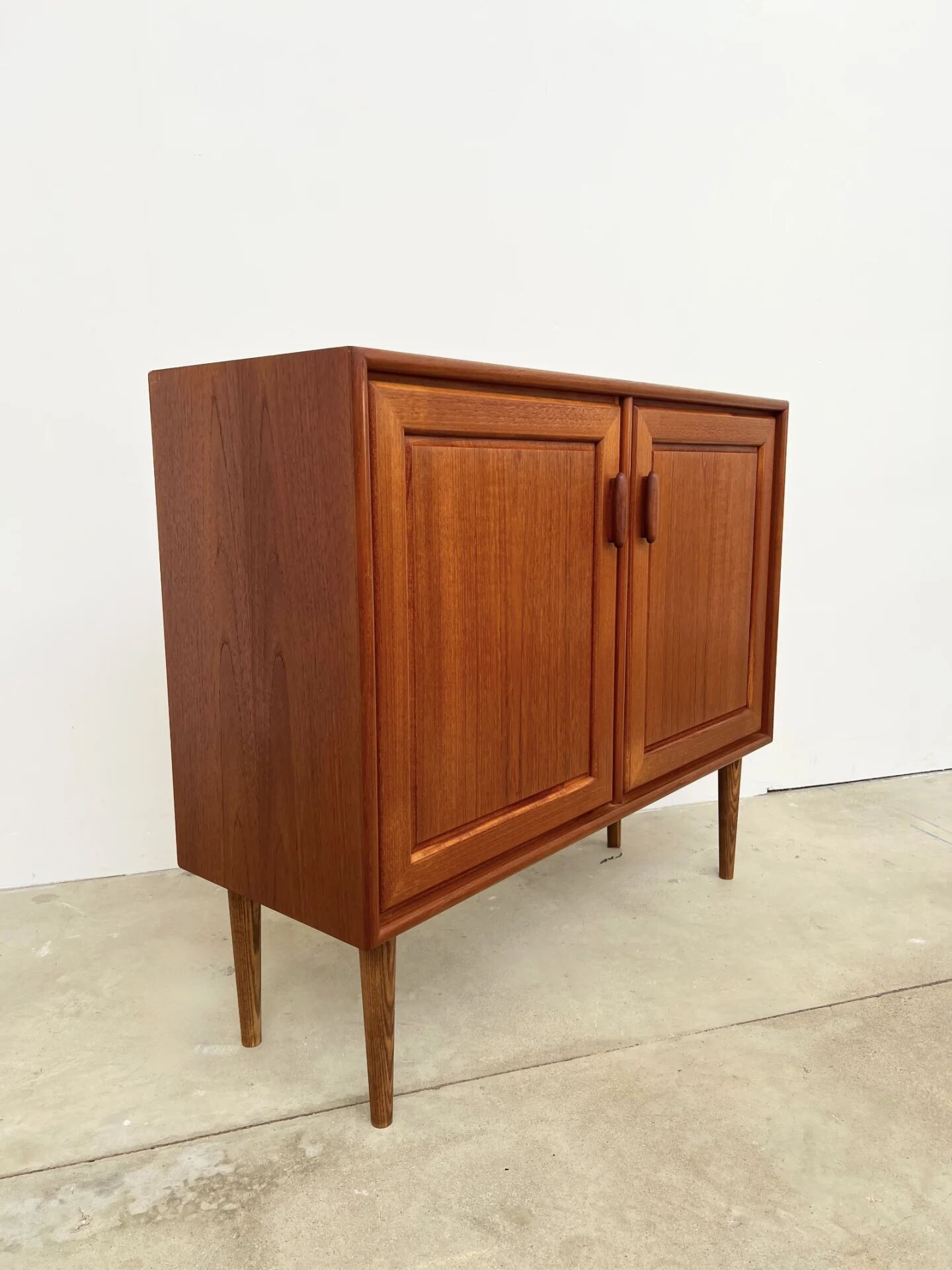 Small teak buffet with 2 doors, vintage Scandinavian style.