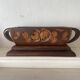 Art Deco jardinière in carved wood, decorated with roses.