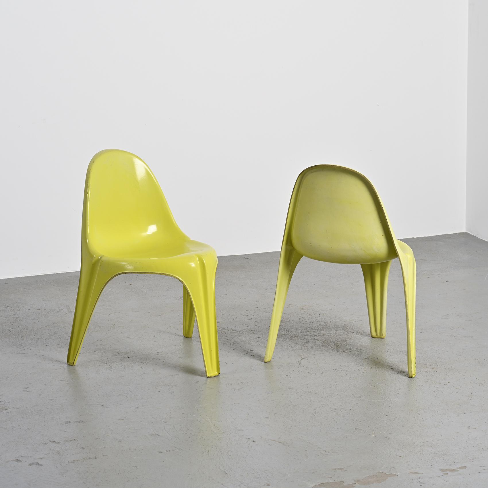 Pair of yellow fiberglass tripod chairs by Walter Frey, circa 1968