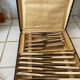 Box of silver metal knives