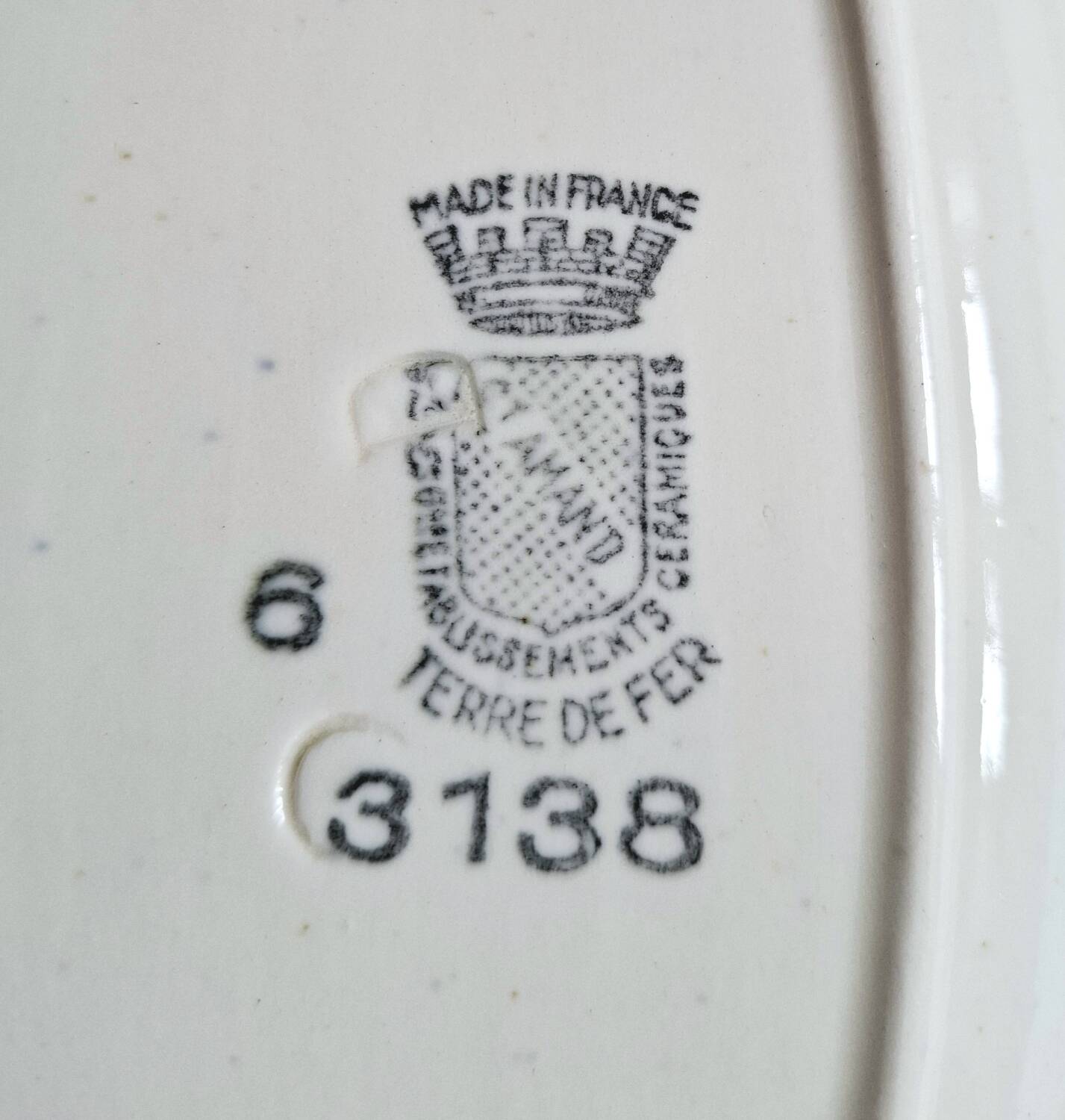 Mismatched antique flat plates accompanied by dishes.