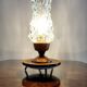 Vintage tripod table lamp from the 1960s with a glass lampshade.