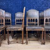 Set of 8 Renaissance style chairs in walnut and embossed leather