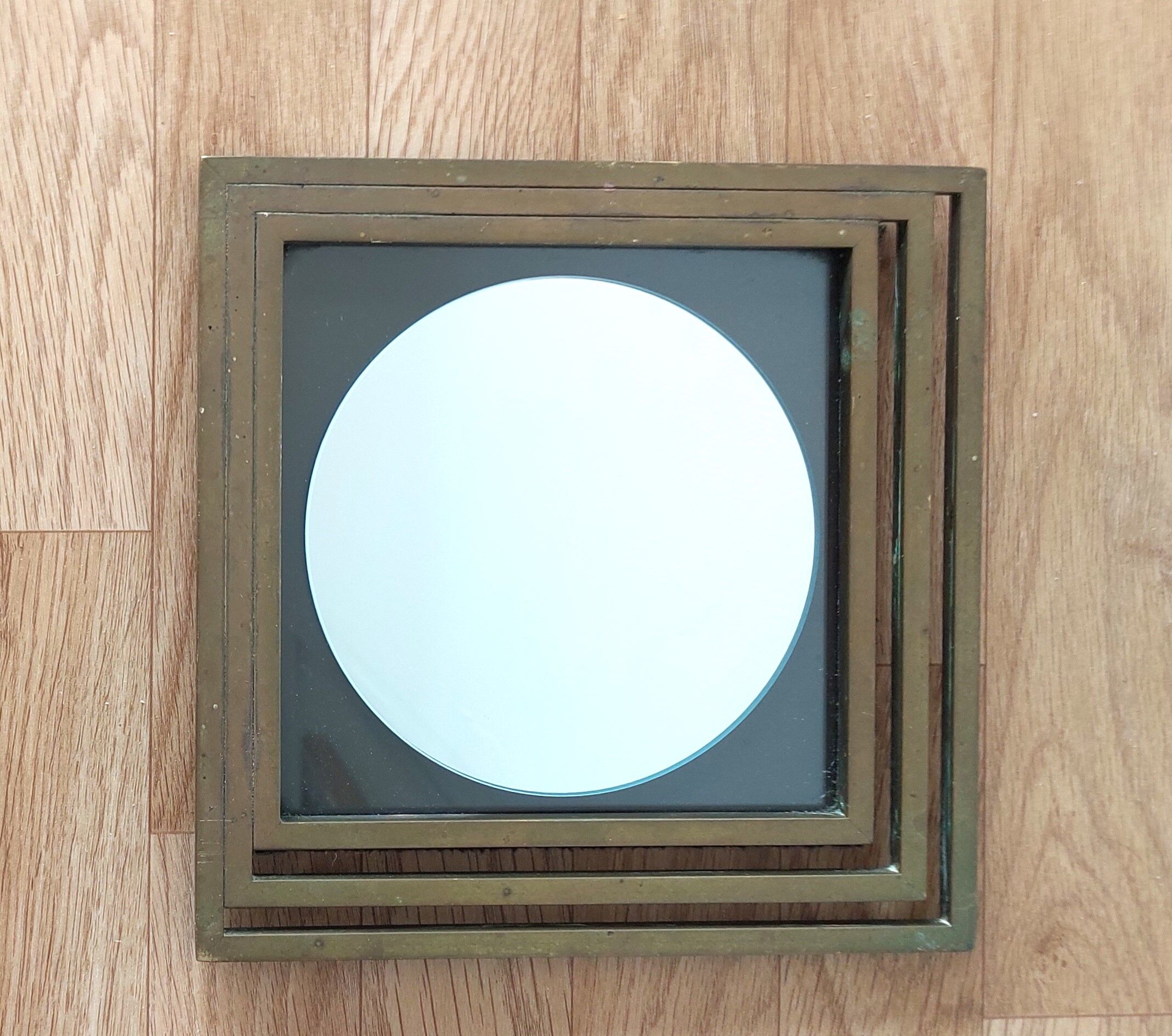 Modernist mirror in gilded brass 1960.