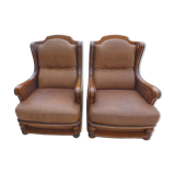 Pair of aged leather armchairs with seat and firm backrest with cherry wood frame