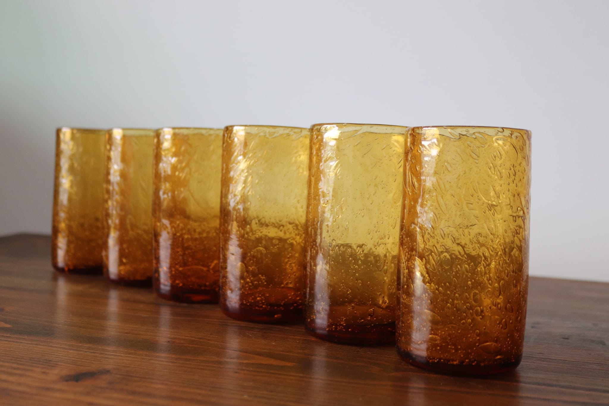 Set of 6 amber, blown and bubbled Biot glasses