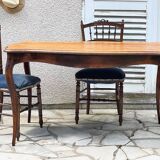 Solid wood table with curved legs