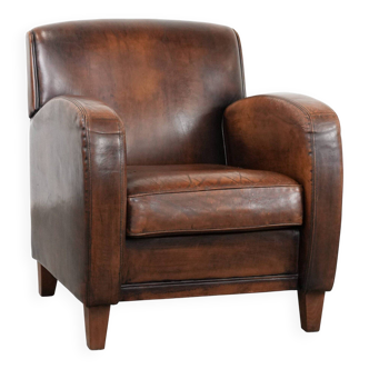 Beautifully shaped vintage sheepskin armchair with character and beautiful colours