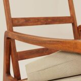 Vintage armchair in olive corduroy with a wooden frame.